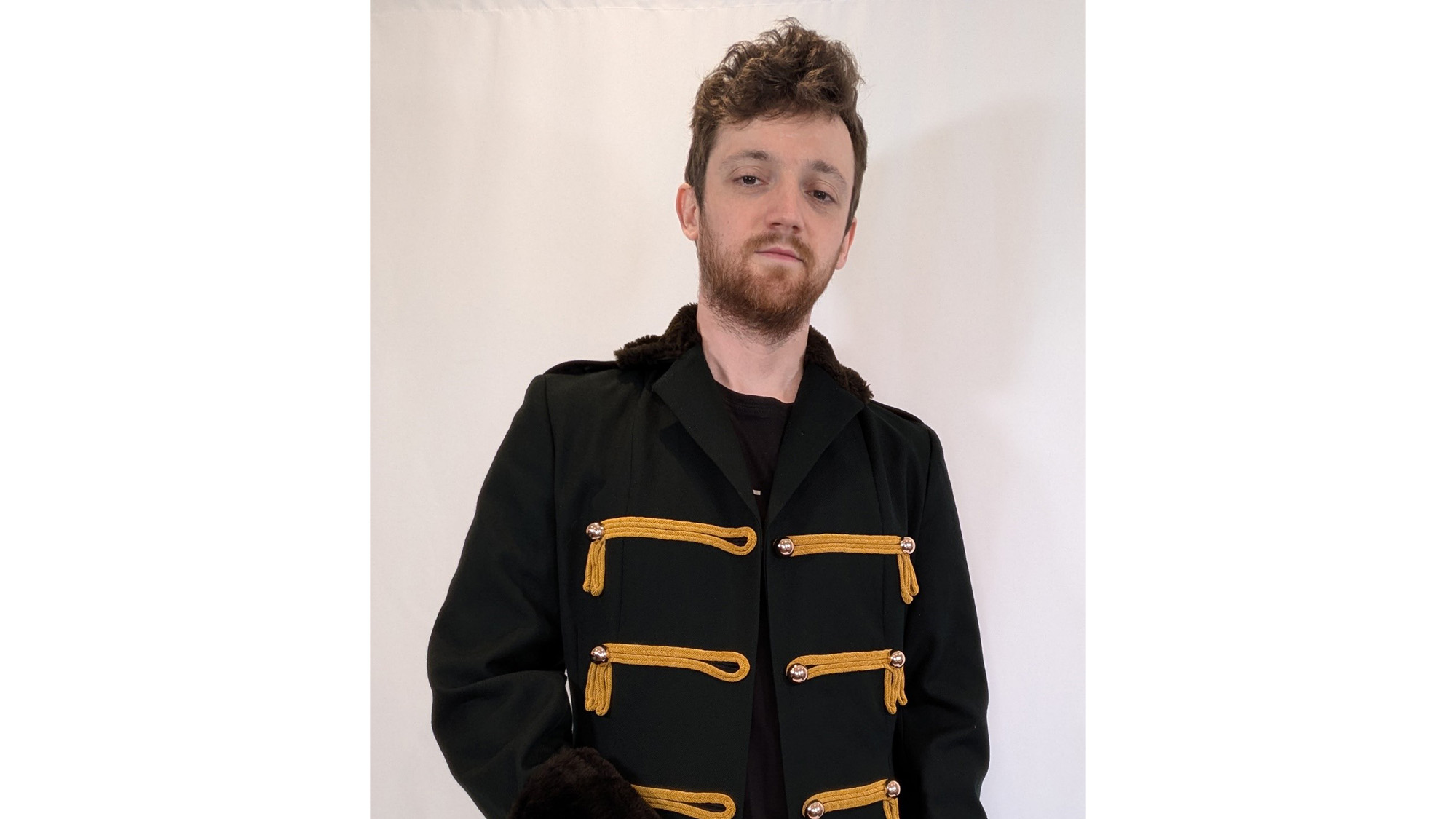 An image of Richard Kirk wearing a military style jacket