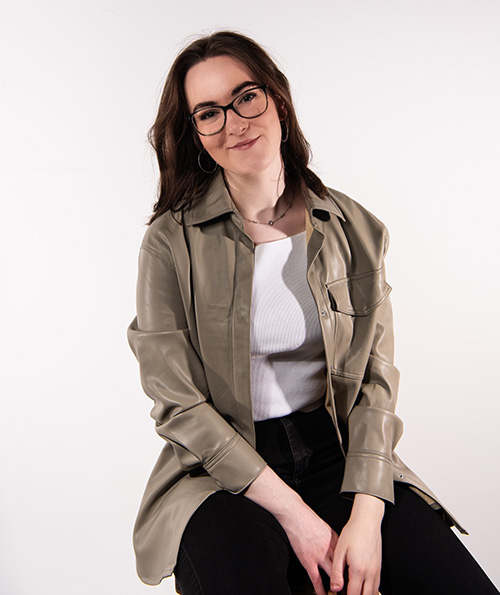 A woman sat on a stool