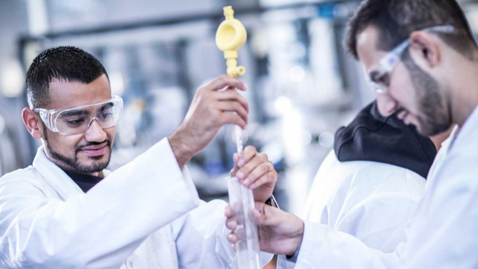 Two students working in a lab