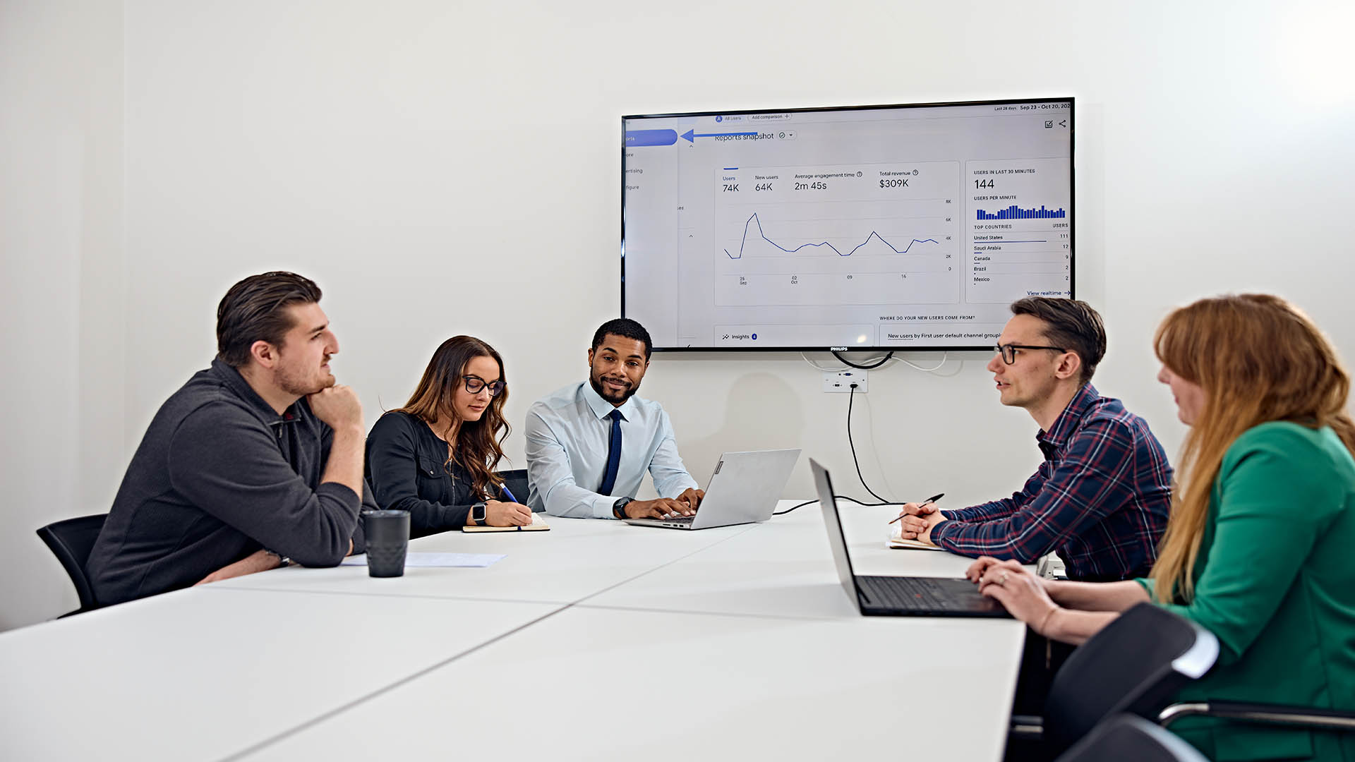 A boardroom meeting between colleagues