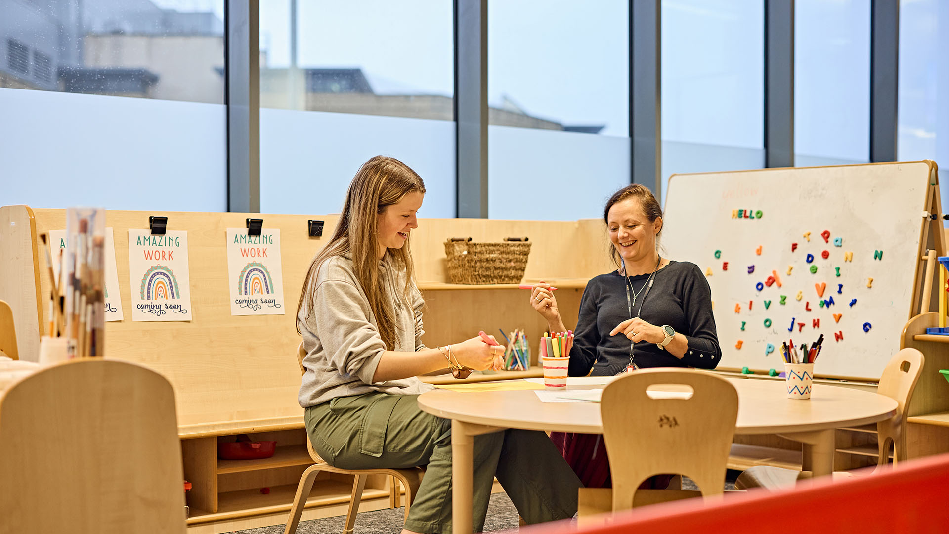 Two primary education teachers in a classroom