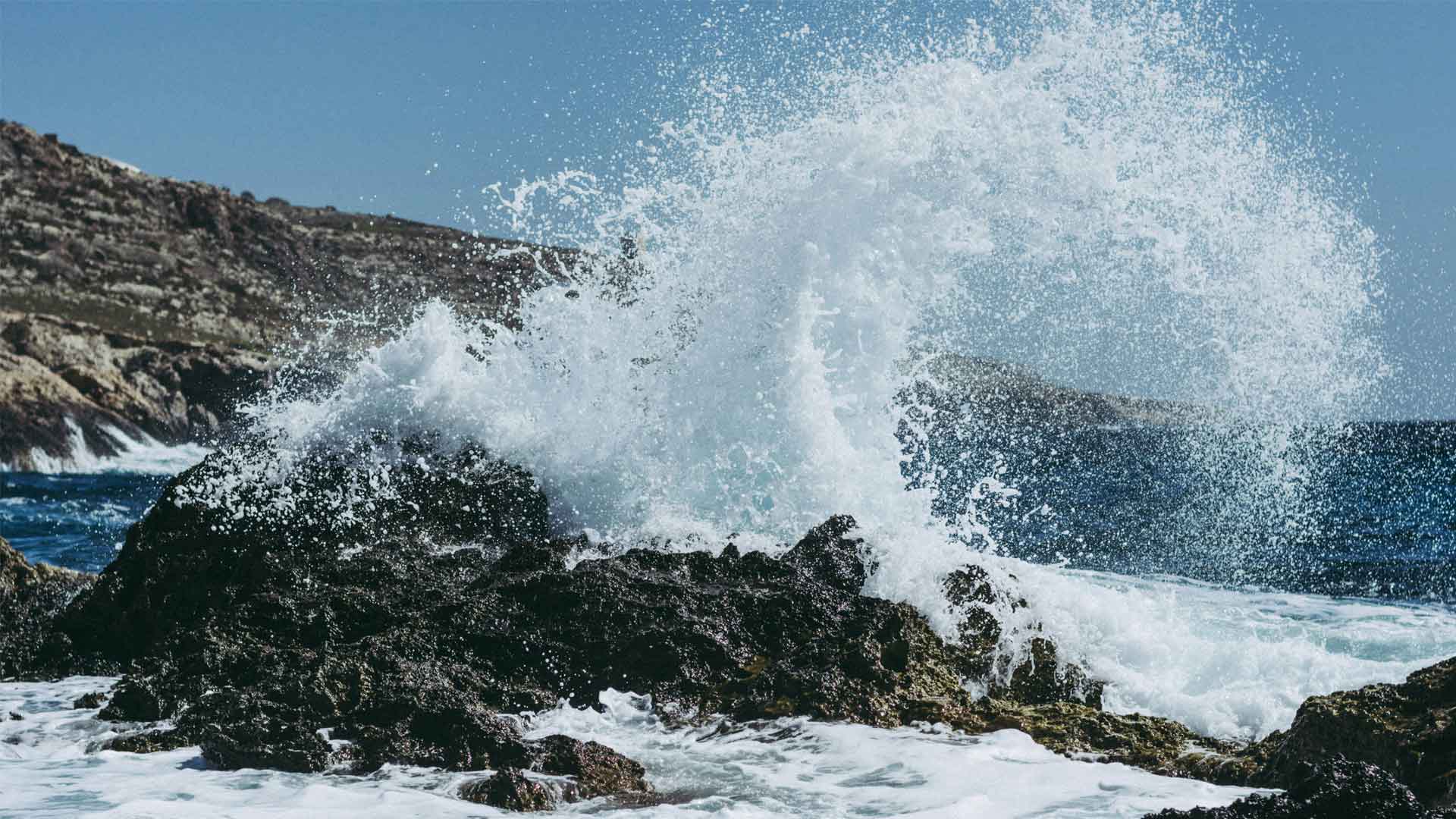 Waves crashing onto rocks