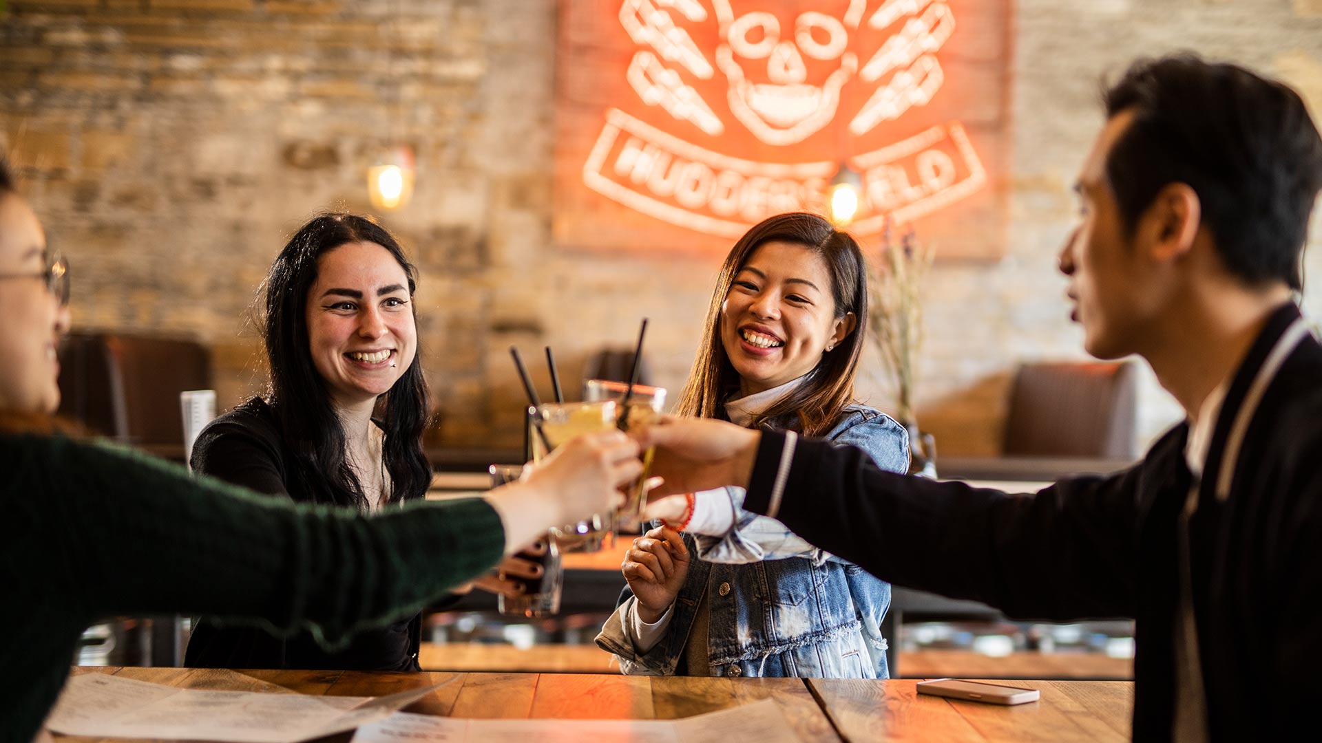 International students drinking at a bar in Huddersfield