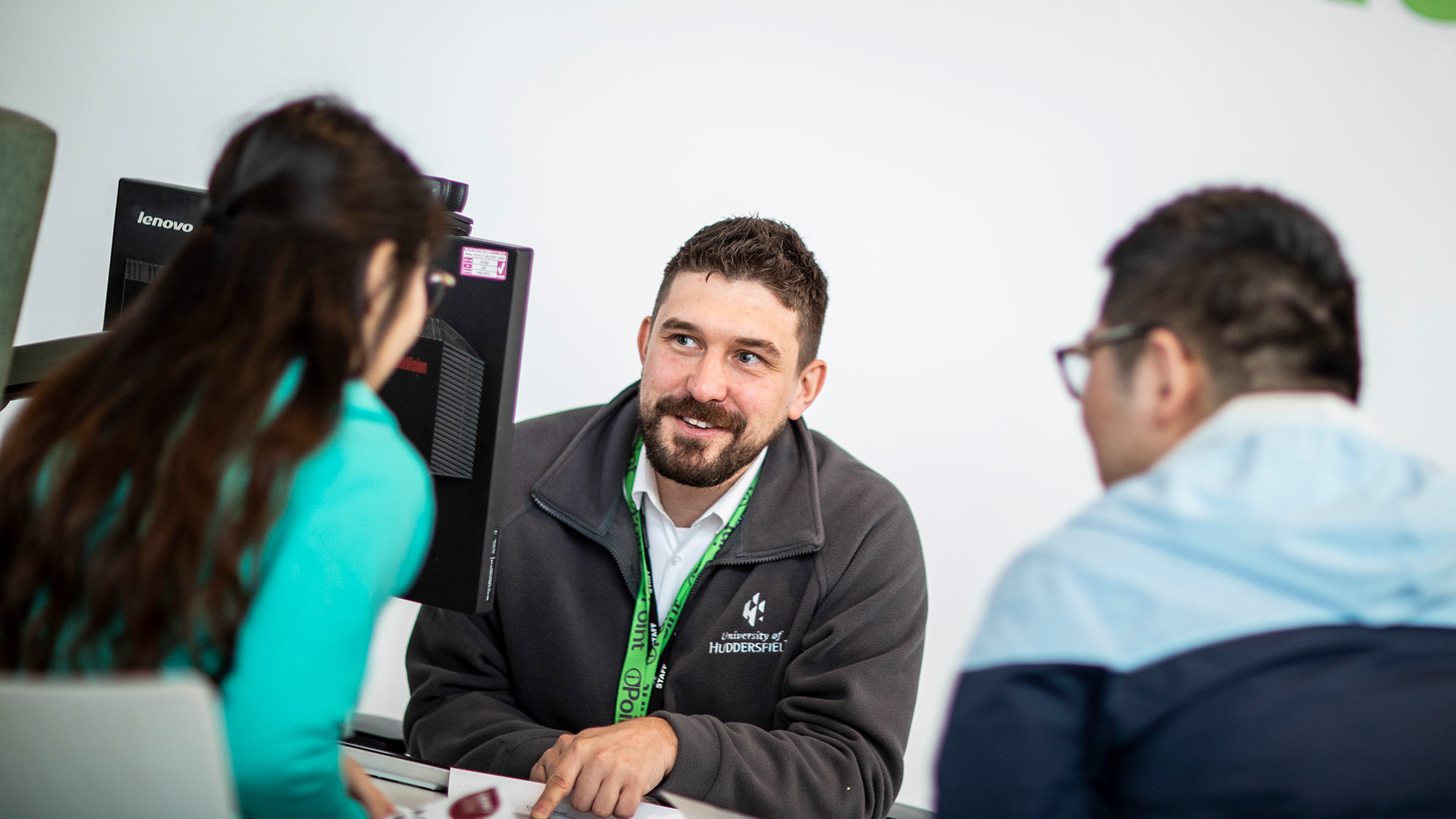A member of the IPoint team helps students