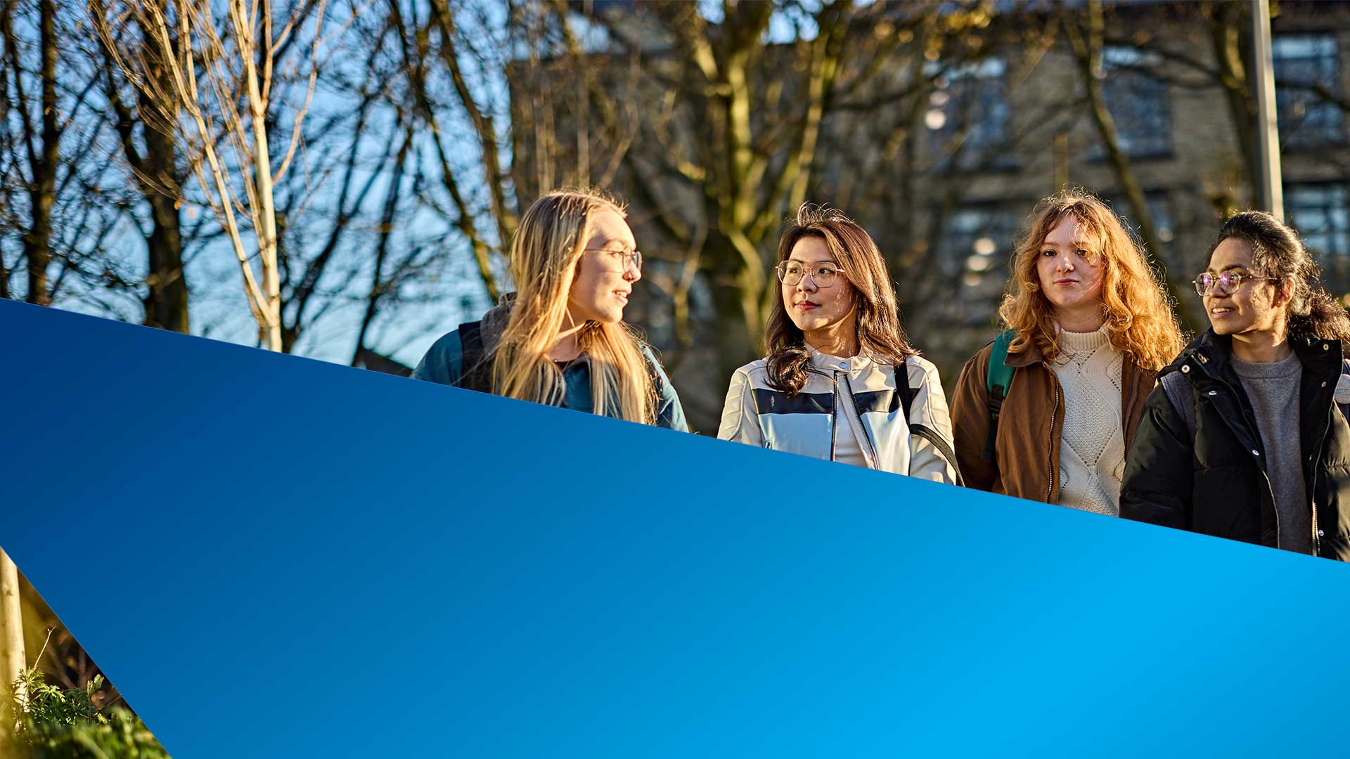 Smiling students walking together on campus