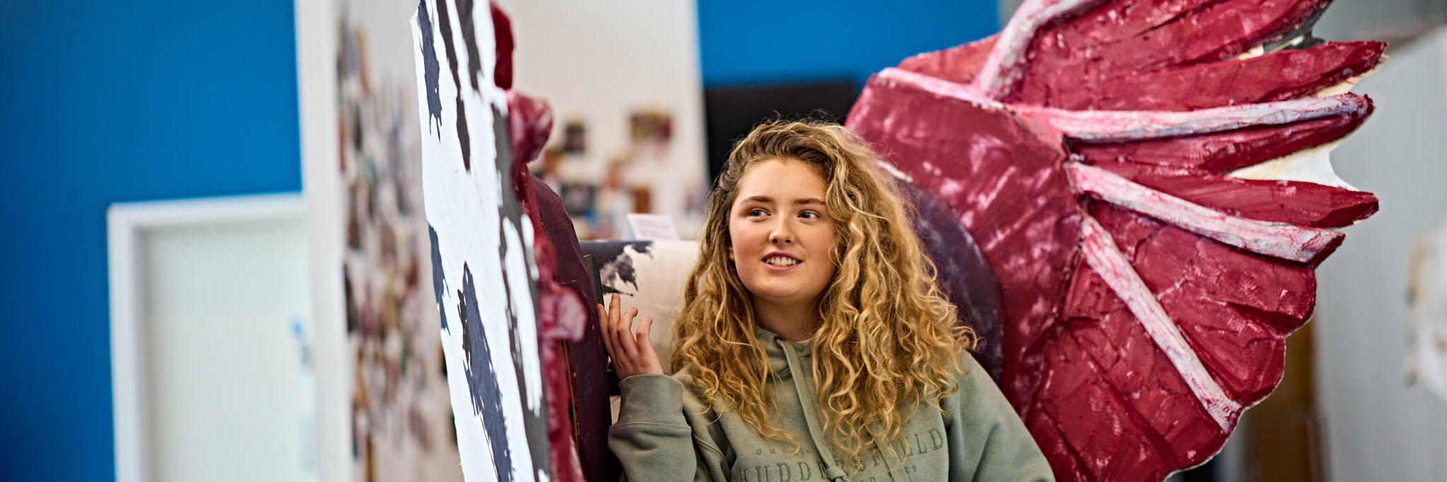 Art and Illustration student sat in her custom handmade chair