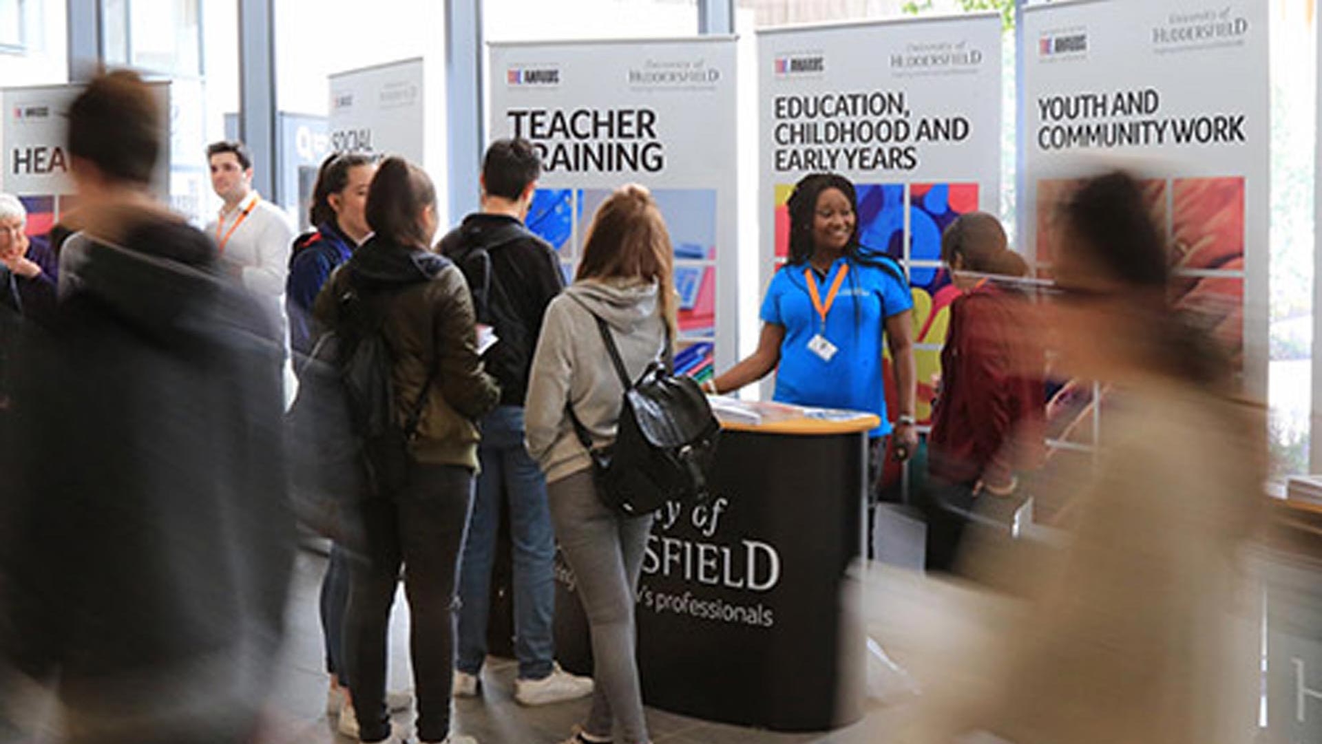 Undergraduate Open Day subject area desks with student ambassadors helping potential candidates